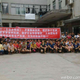Workers at the factory of Uniqlo’s supplier holding banners to ask for their “sweat money.” (Weibo)